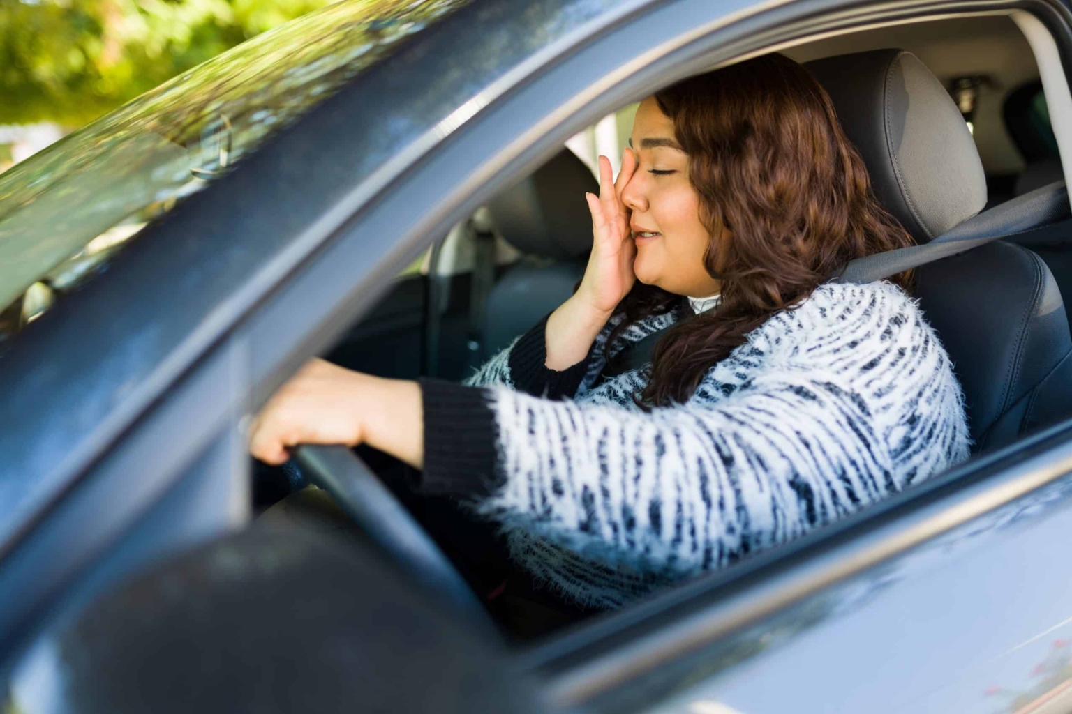Depressed,Latin,Woman,Crying,And,Looking,Sad,While,Driving,Her