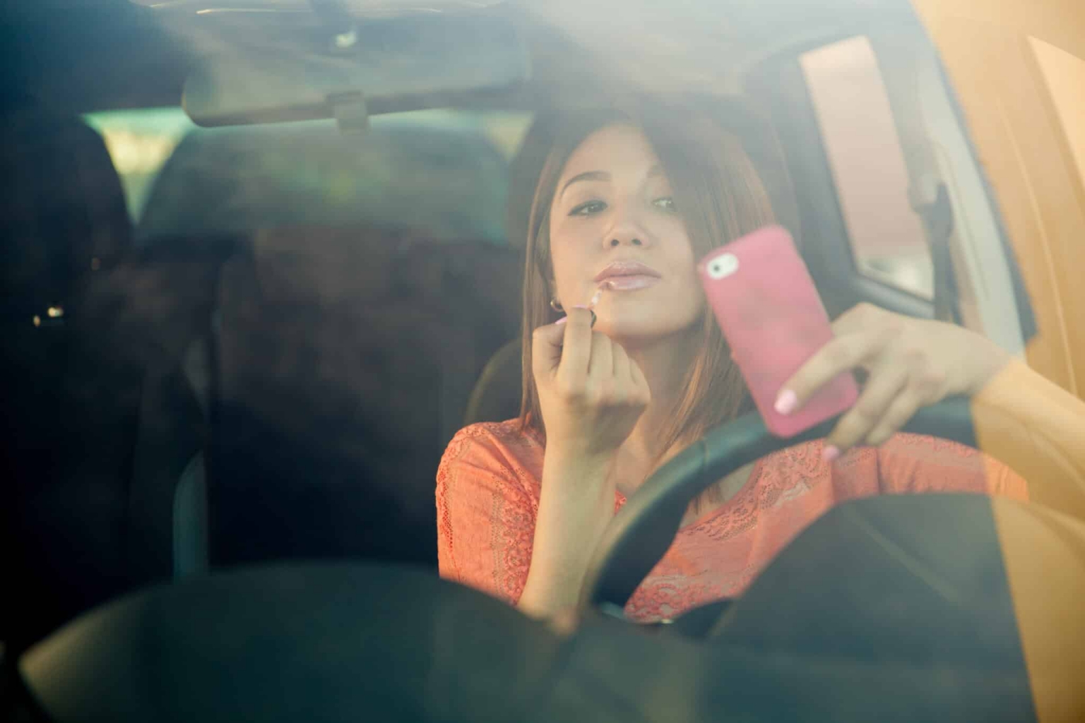 Portrait,Of,A,Distracted,Young,Woman,Looking,At,Her,Smartphone