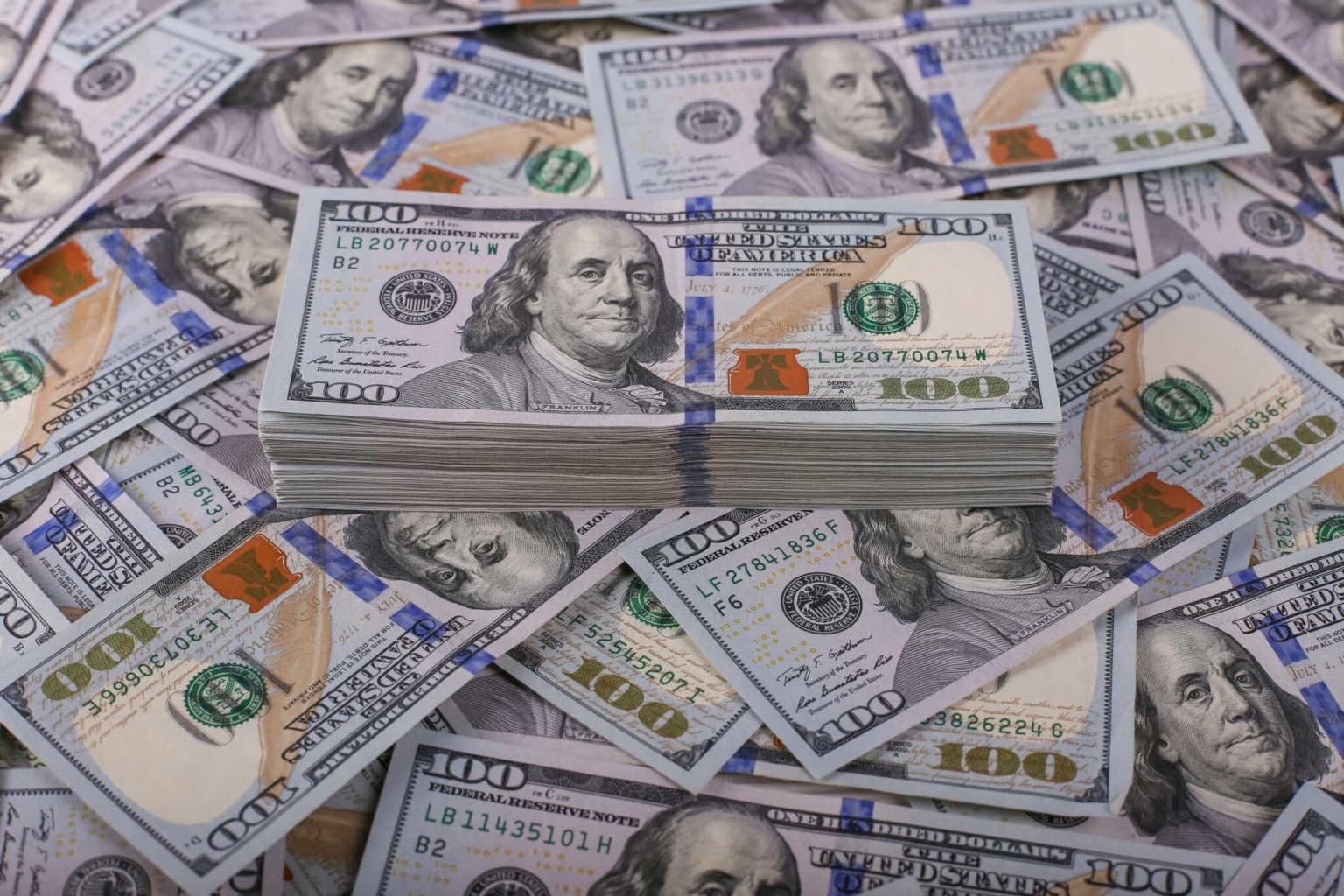 American,Dollars,In,One,Hundred,Banknotes.,Lot,Of,Dollars,Close