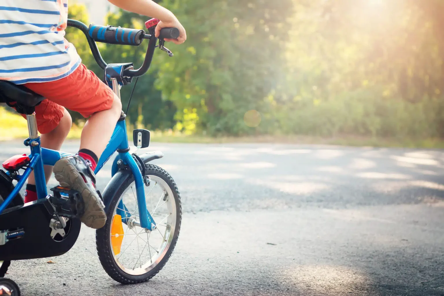 Child,On,A,Bicycle,At,Asphalt,Road